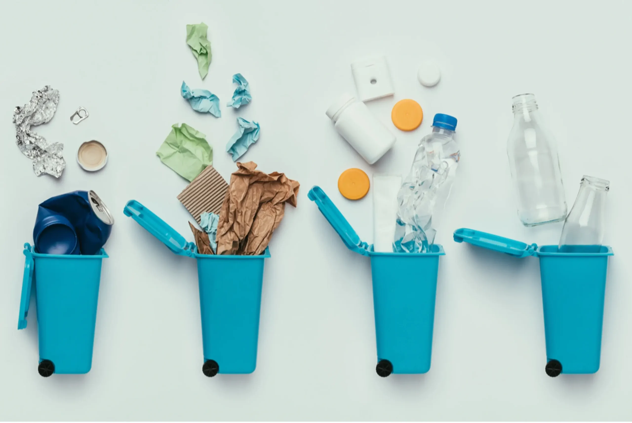 Sustainability 101: What To Do With Your Plastics 2 trash being thrown in recyling bins