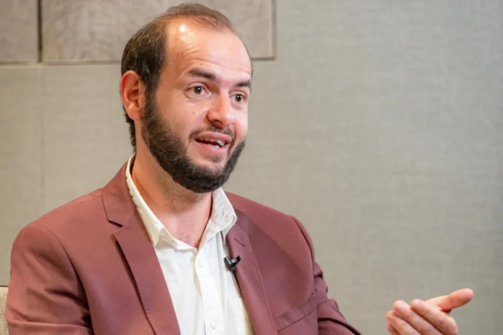 Global Entrepreneurship Month: Qnet Success Stories To Inspire 8 Omar Medhat talking in an interview