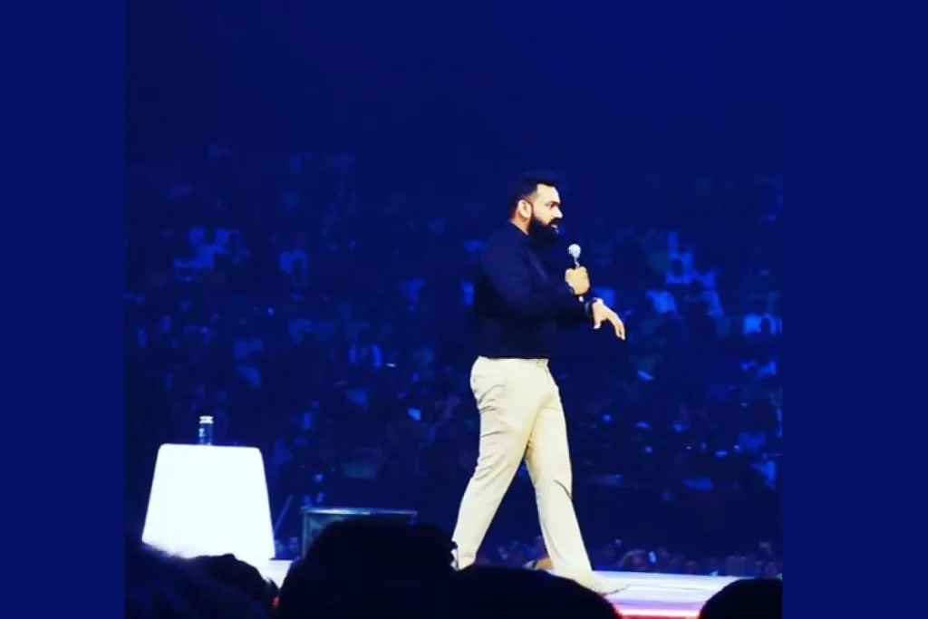 Global Entrepreneurship Month: Qnet Success Stories To Inspire 10 Midhulaj Paramba on stage