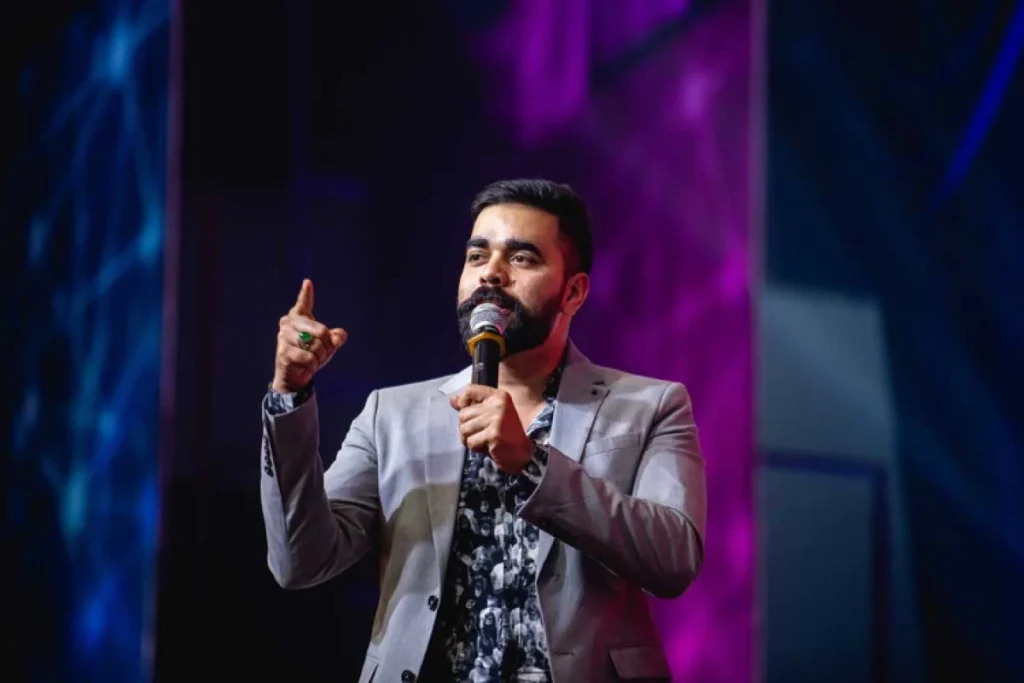 Global Entrepreneurship Month: Qnet Success Stories To Inspire 7 Nasib BR on stage talking