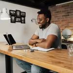 Direct Selling Industry Beginner looking at his devices