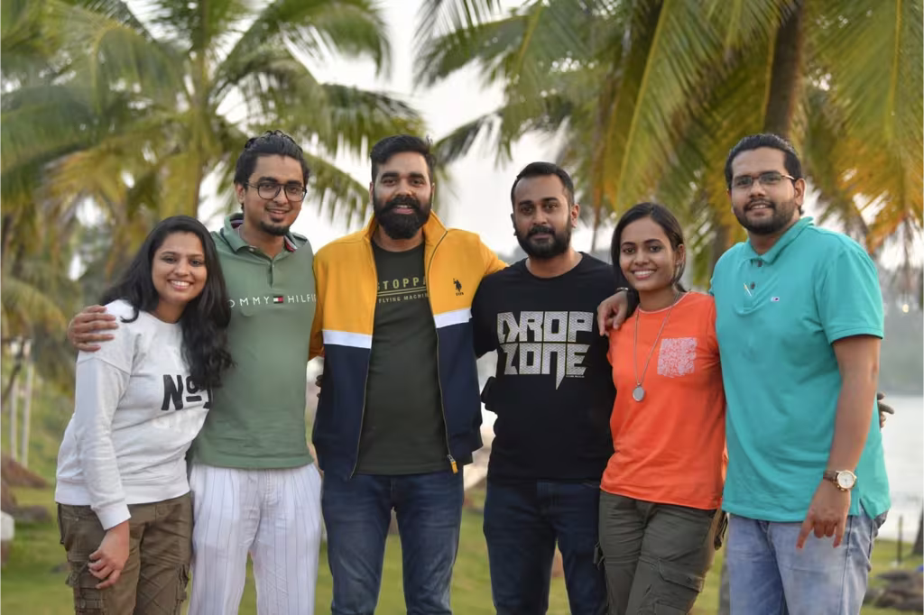 Ashik BR standing outside with friends