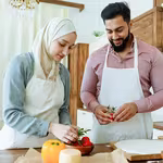 Man and woman preparing food for Ramadan