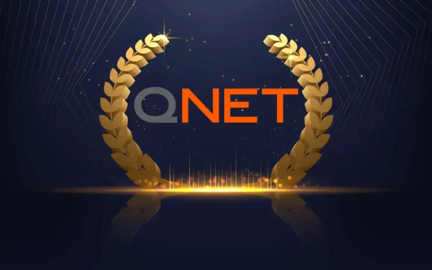 QNET logo inbetween victory ferns for QNET awards