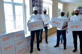 Representatives from QNET, through RYTHM Foundation, donate goods for Ramadan 2021