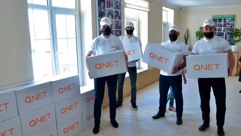 Representatives from QNET, through RYTHM Foundation, donate goods for Ramadan 2021
