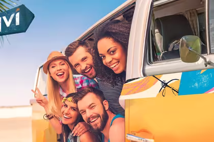 Members of the QVI Club peek out of their van