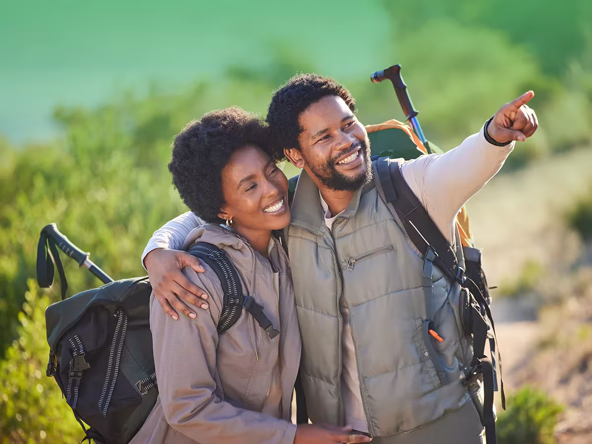 couple hiking outside qvi breaks