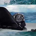 Wave Rider surf watch on top of a surf board in the water