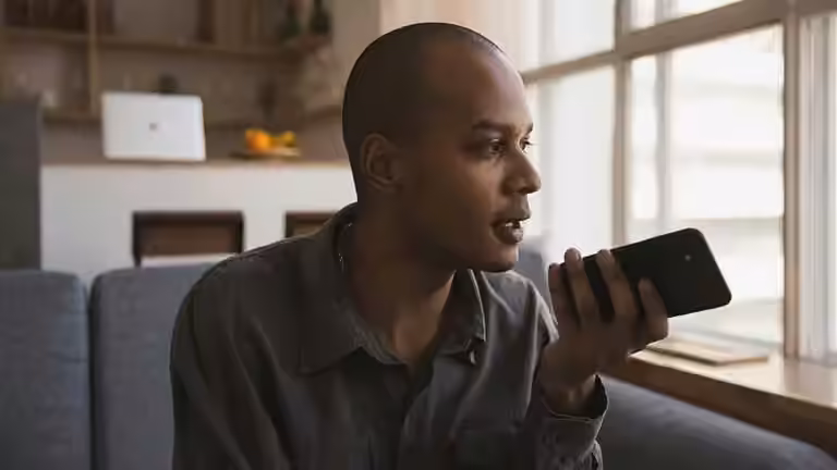Man recording a voice message and wondering is the middle class the new poor